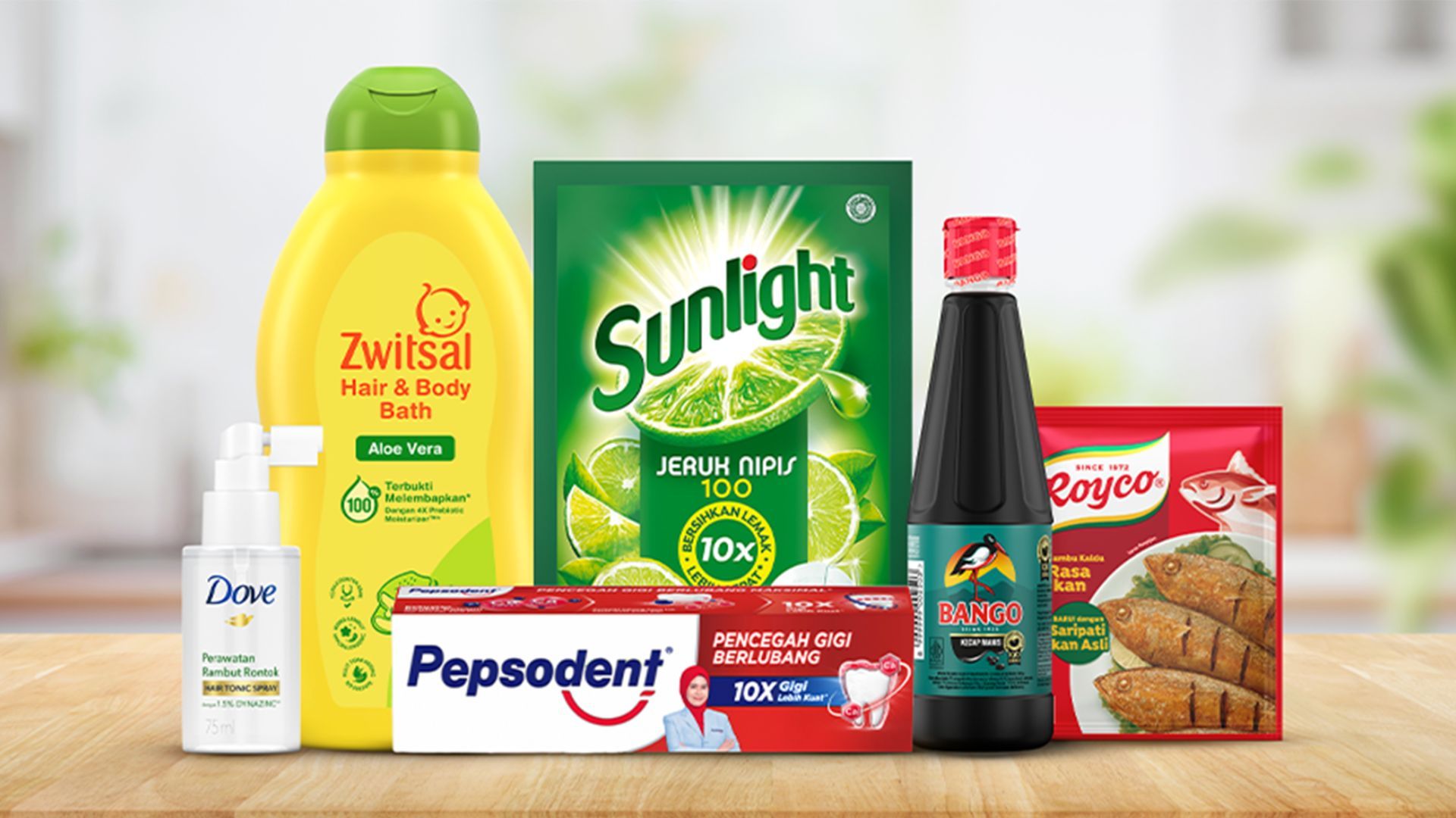 Various household products on a wooden surface with green and white background.
