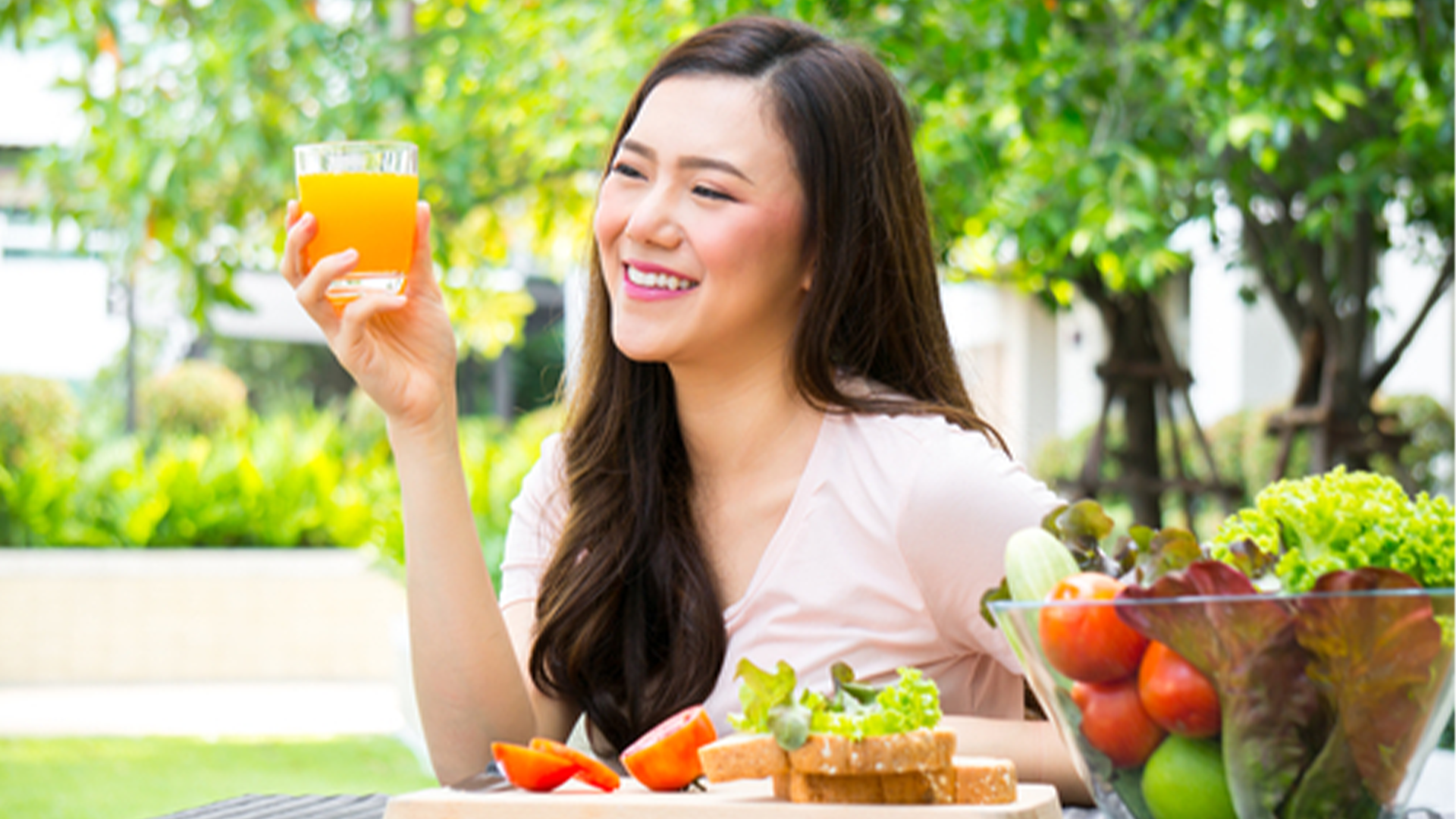 A woman drinking a fruit juice