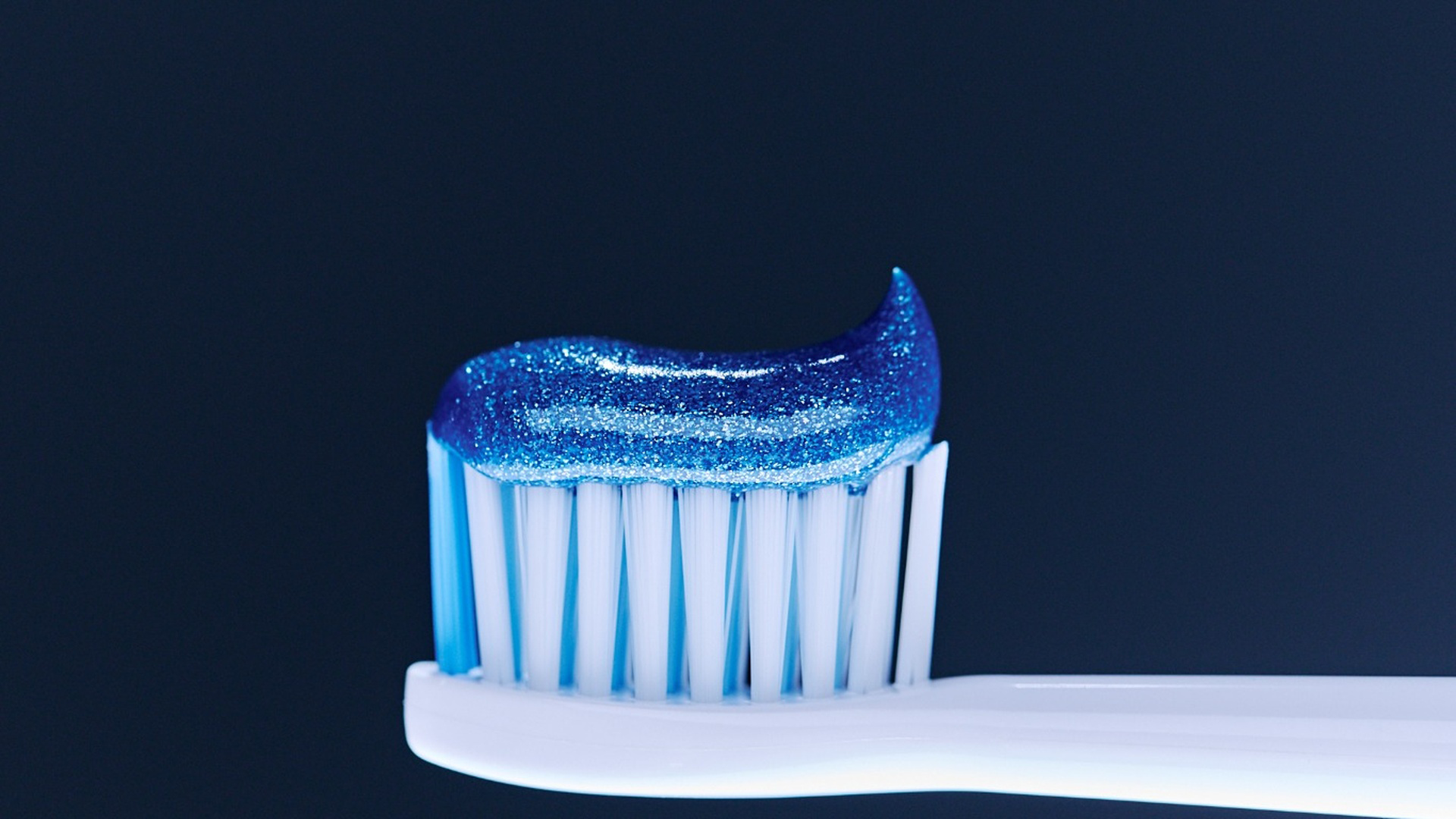 Pepsodent toothpaste on a toothbrush