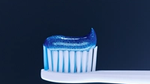 Pepsodent toothpaste on a toothbrush