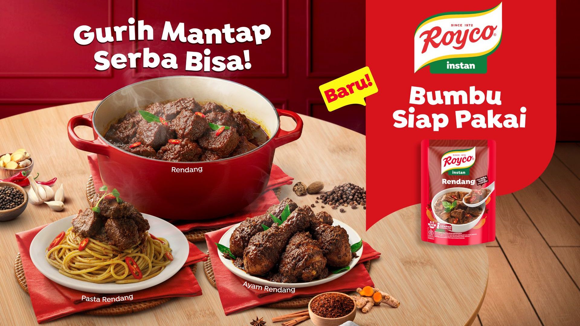A vibrant display featuring Royco's instant Rendang dish, with tender beef and chicken served on pasta, alongside cooking spices.