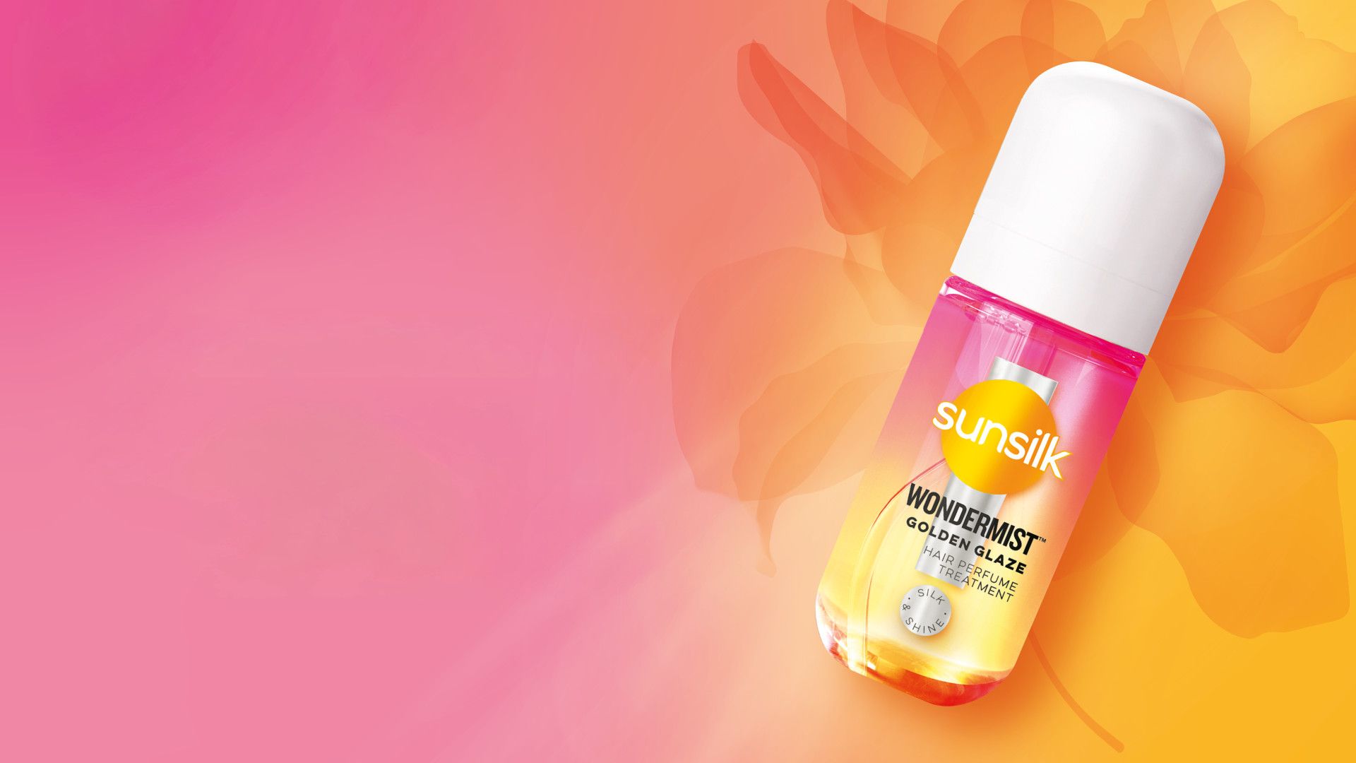 Sunsilk’s new Wonder Mist hair mist in Golden Glaze. A small pink and orange spray bottle on a pink and orange background.