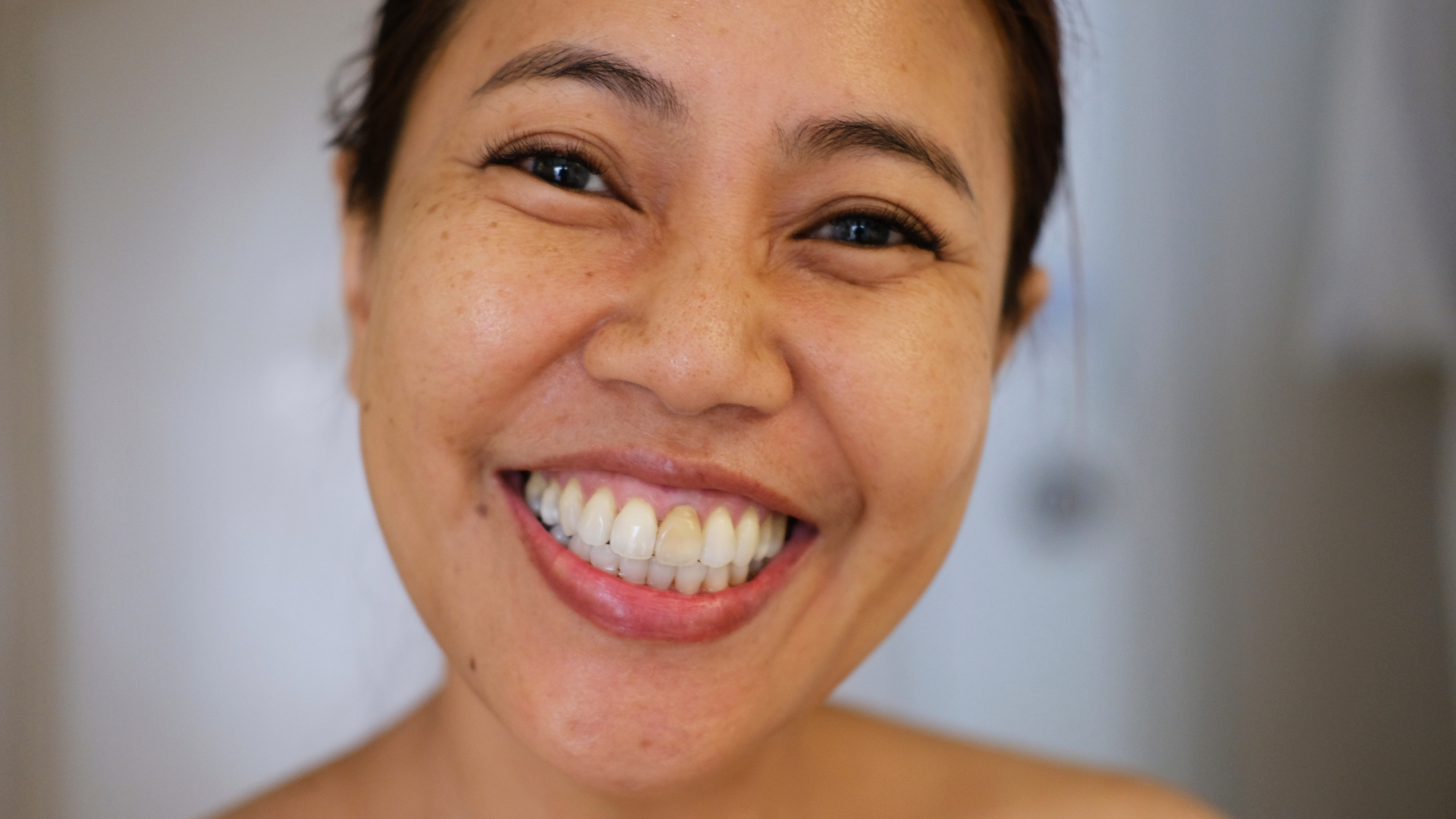 Smiling person with a joyful expression.