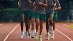 Group of runners on a track.